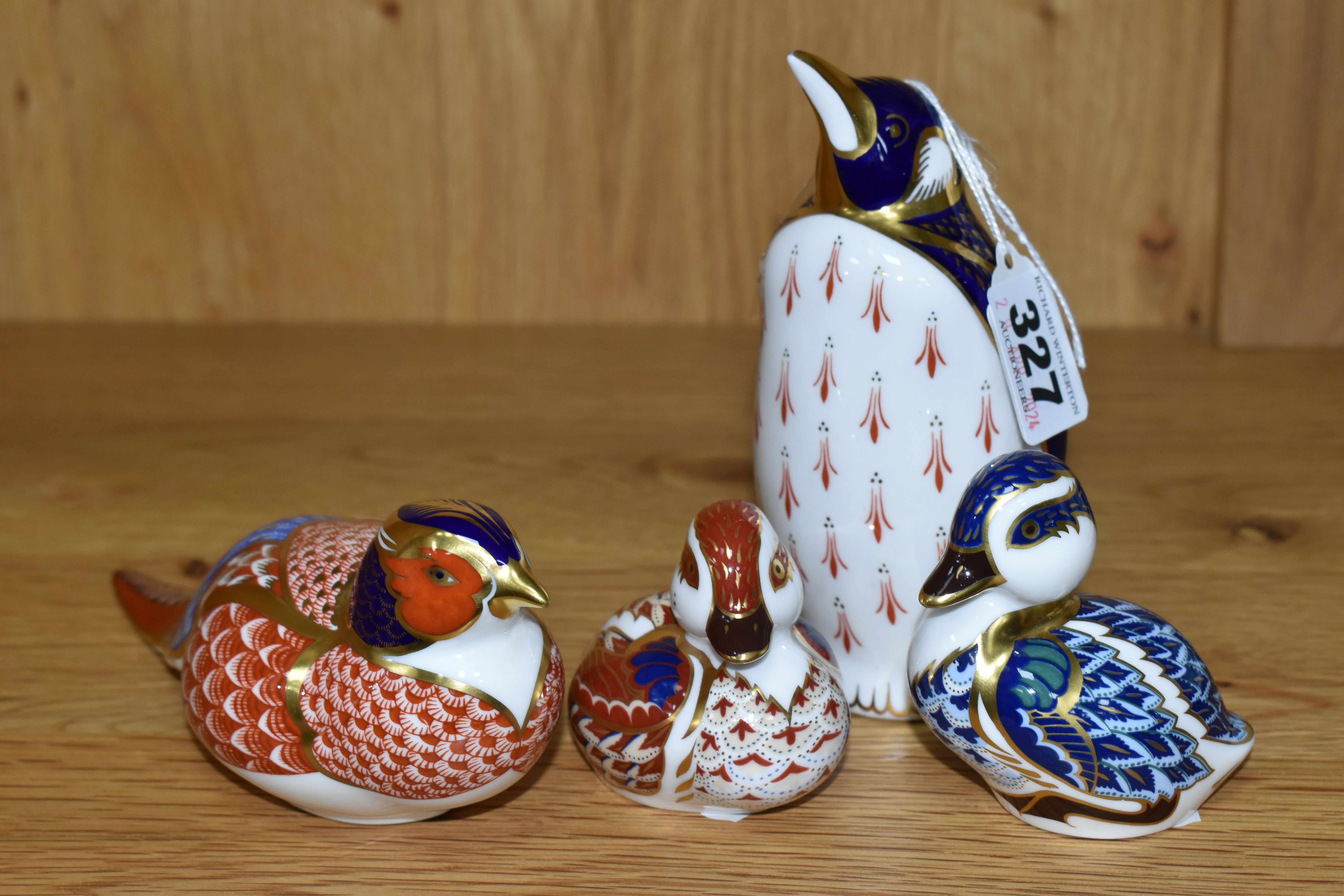 FOUR ROYAL CROWN DERBY PAPERWEIGHTS, comprising a Penguin, gold stopper, height 13cm, a Pheasant,