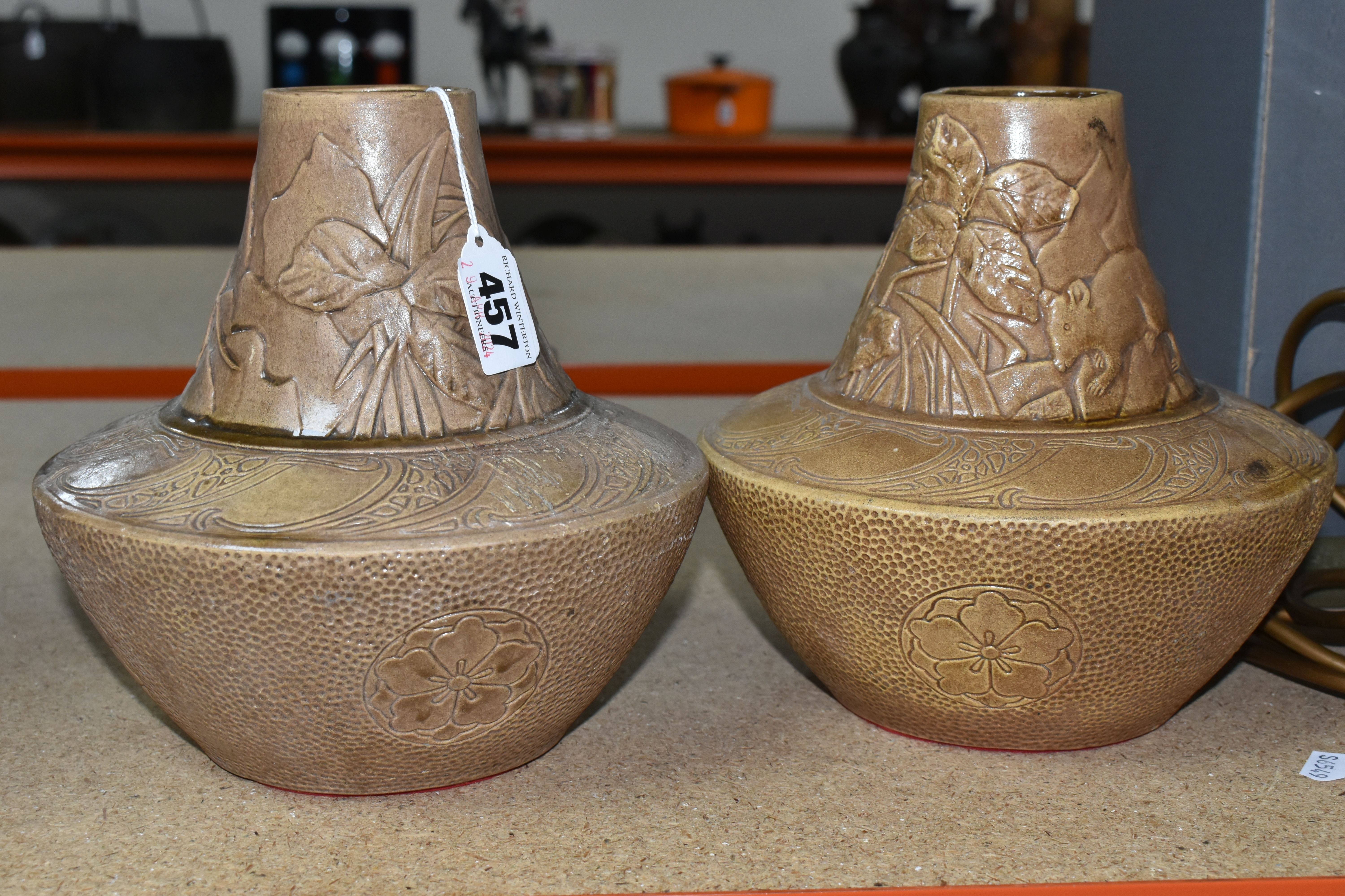 A PAIR OF DELHI WARE VASES, two Art Nouveau Bretby (Tooth & Co.) Delhi Ware bronze effect pottery