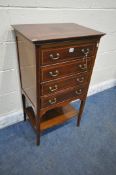AN EDWARDIAN MAHOGANY MUSIC CABINET, with four fall front drawers, raised on tapered legs, united by