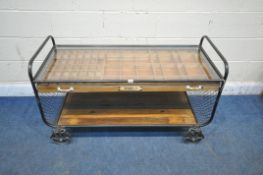 AN INDUSTRIAL STYLE COFFEE TABLE, the tubular metal frame, cradling a glass top, a single drawer