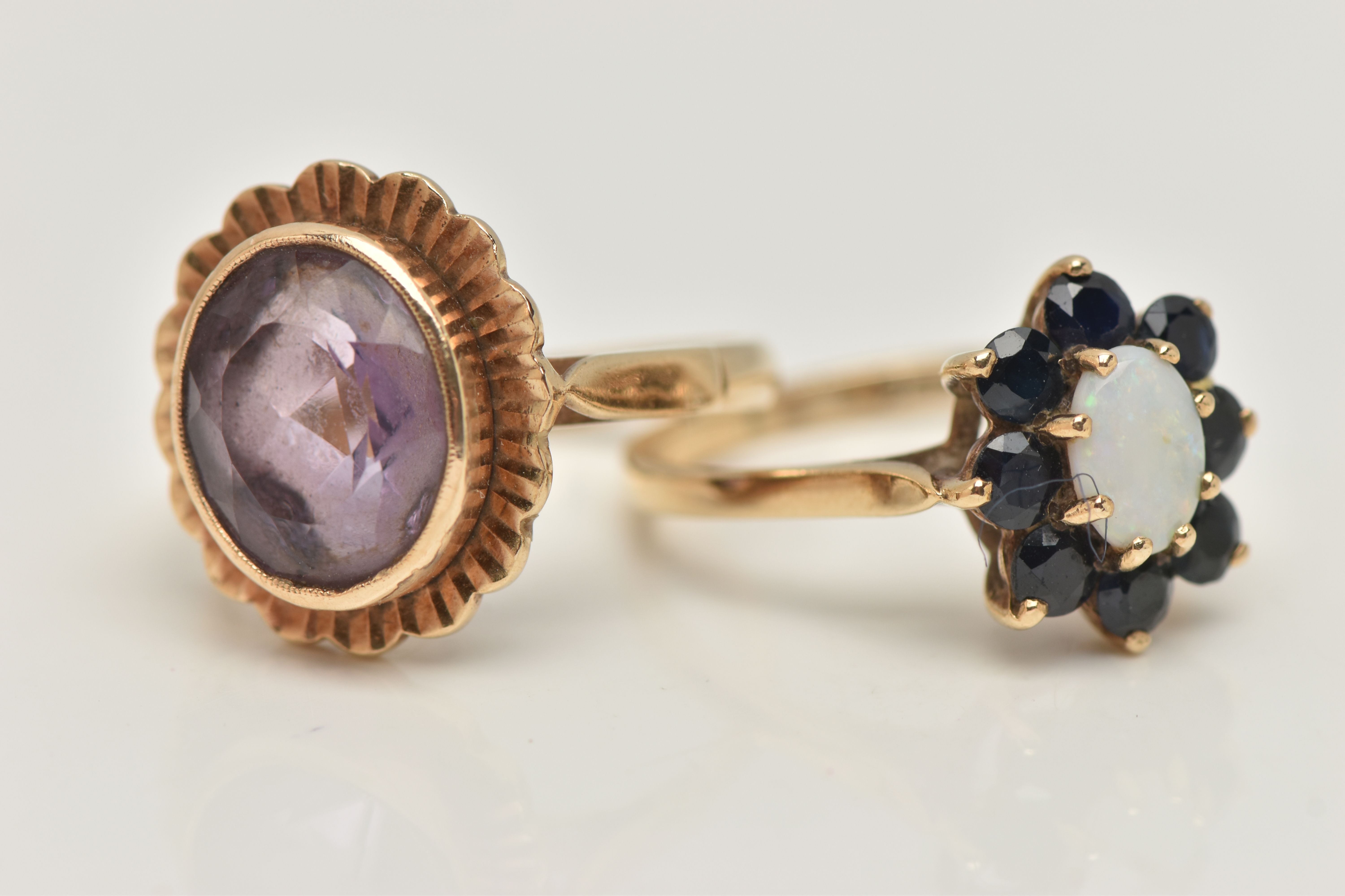 TWO GEM SET RINGS, the first an oval opal set with a surround of circular cut sapphires, prong set - Image 2 of 4