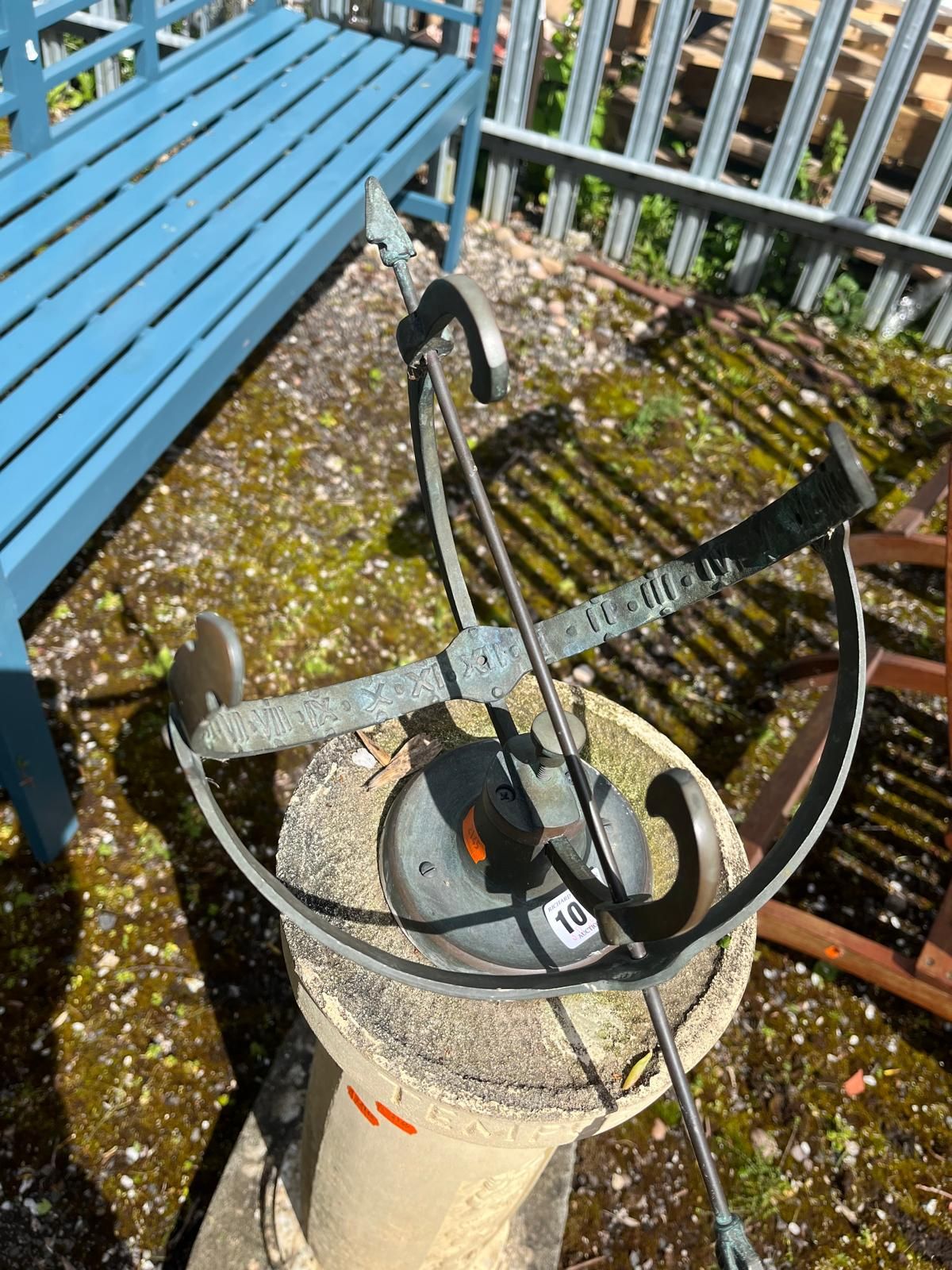 AN ARMILLARY SPHERE BRASS SUNDIAL ON A COMPOSITE COLUMN BASE with foliate panels and 'Tempus - Image 3 of 4