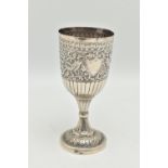 A LATE 19TH CENTURY INDIAN WHITE METAL GOBLET, repoussé decorated with foliate scrolls and birds,