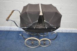 A SMALL BROWN SILVER CROSS PRAM, with two fold down canopies, on a shaped frame and two pairs of