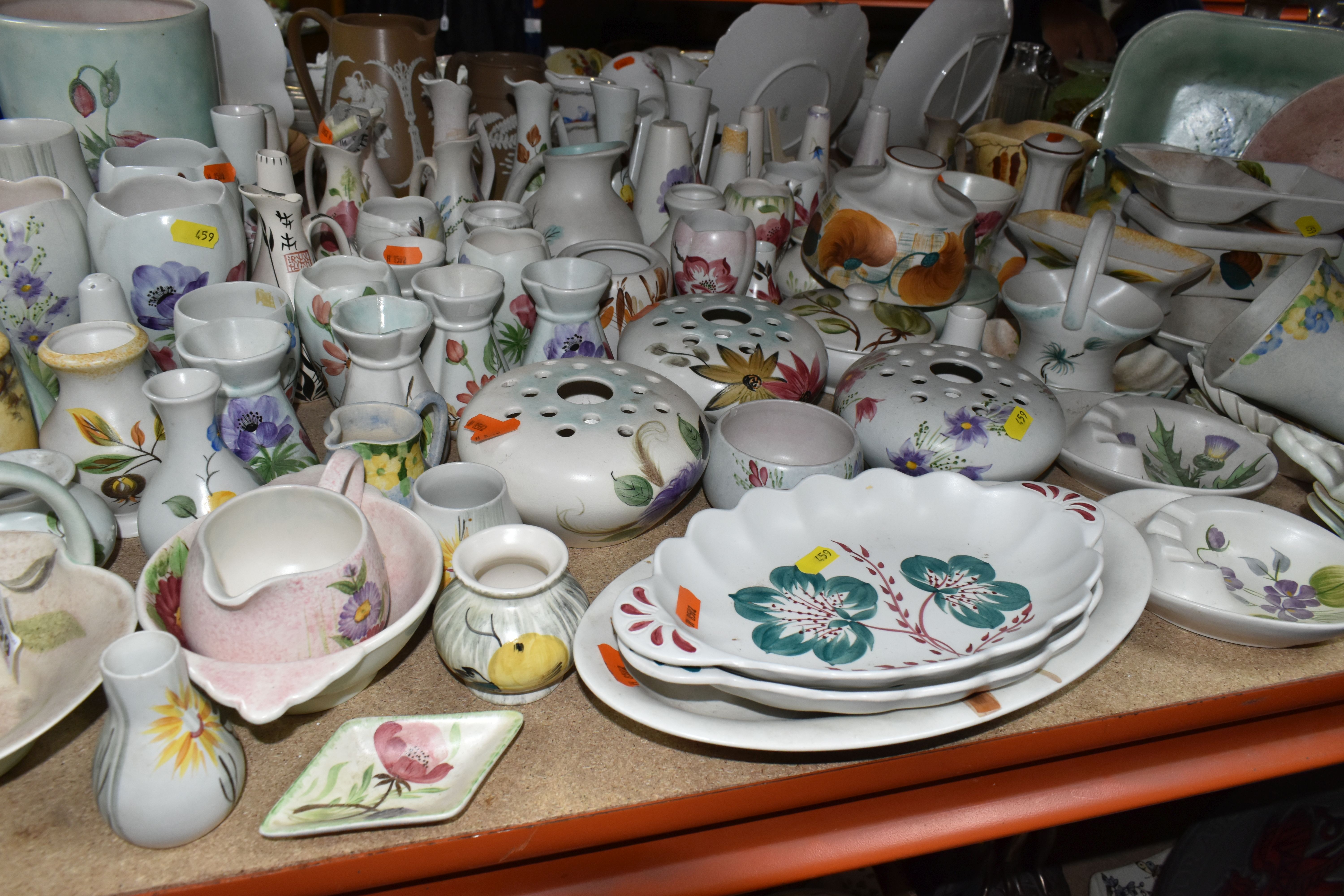 A LARGE QUANTITY OF RADFORD WARE, comprising butter dishes, salt and pepper shakers, bud vases,