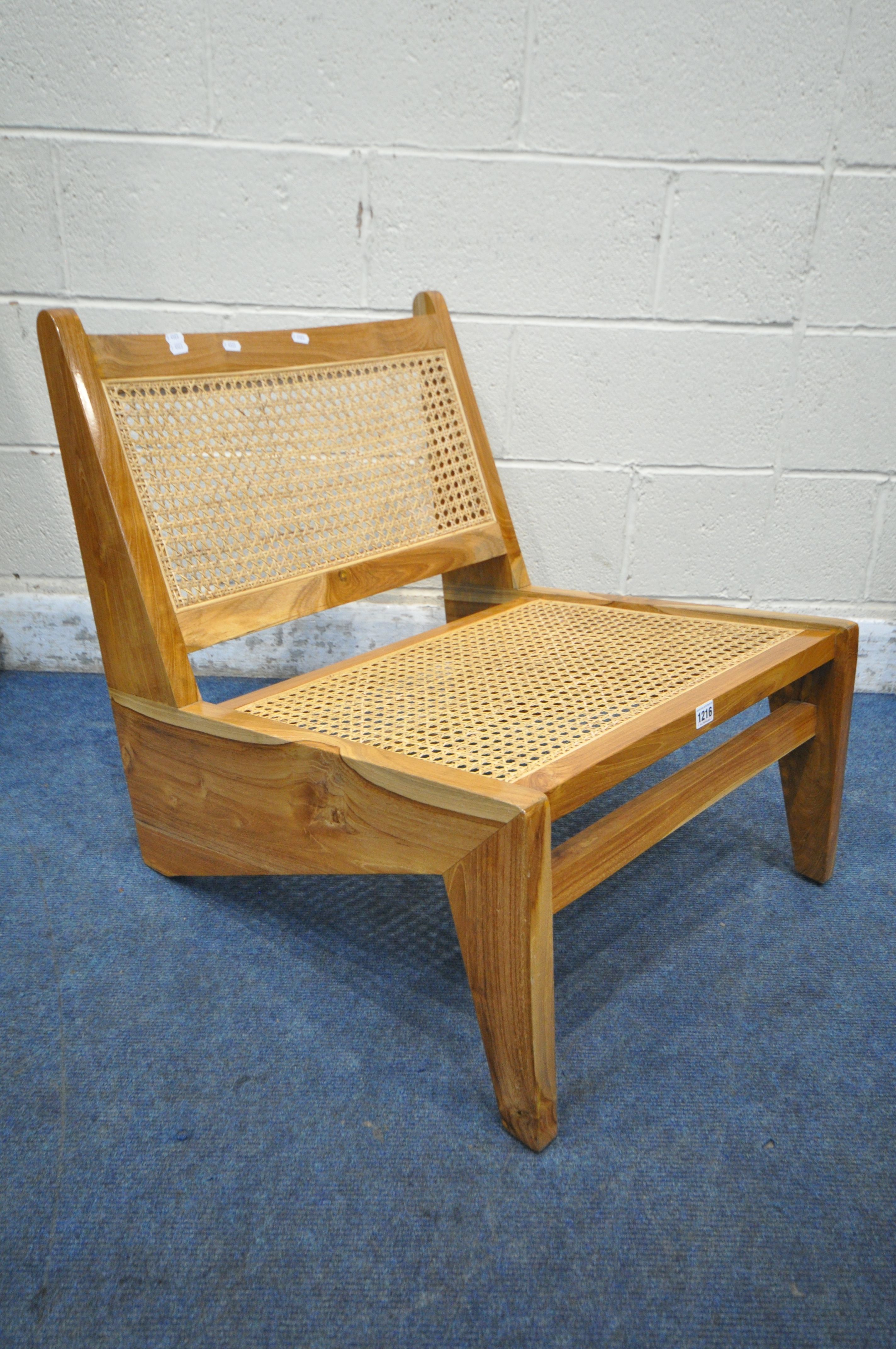 IN THE MANNER OF PIERRE JEANNERET FOR CHANDIGARH, A MID CENTURY HARDWOOD KANGAROO CHAIR, with cane