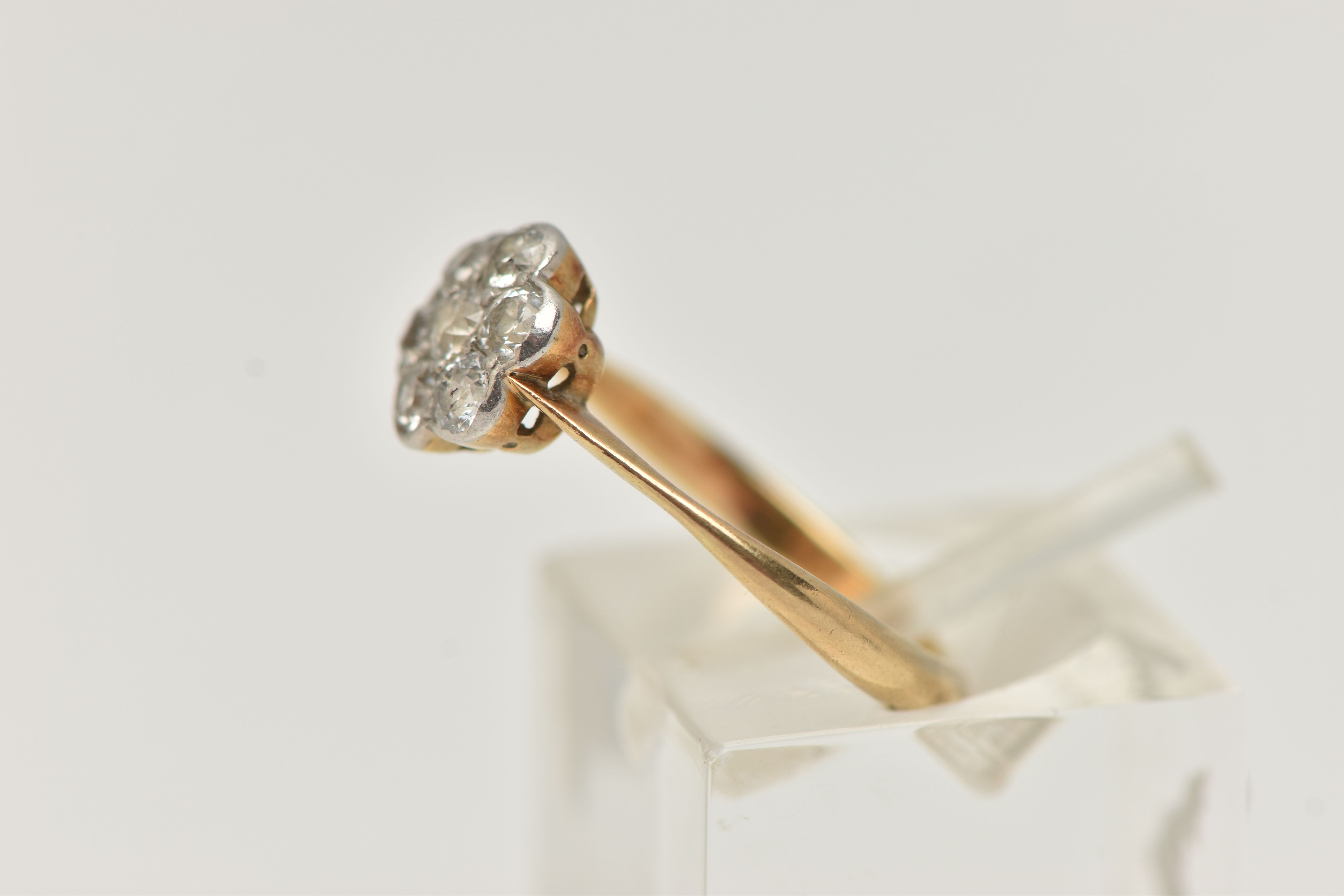 A YELLOW METAL DIAMOND CLUSTER RING, flower shape cluster set with seven old cut diamonds, estimated - Image 2 of 4