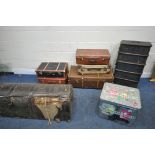 A VARIETY OF TRAVELING TRUNKS, to include two wooden banded and canvas trunks, a distressed large