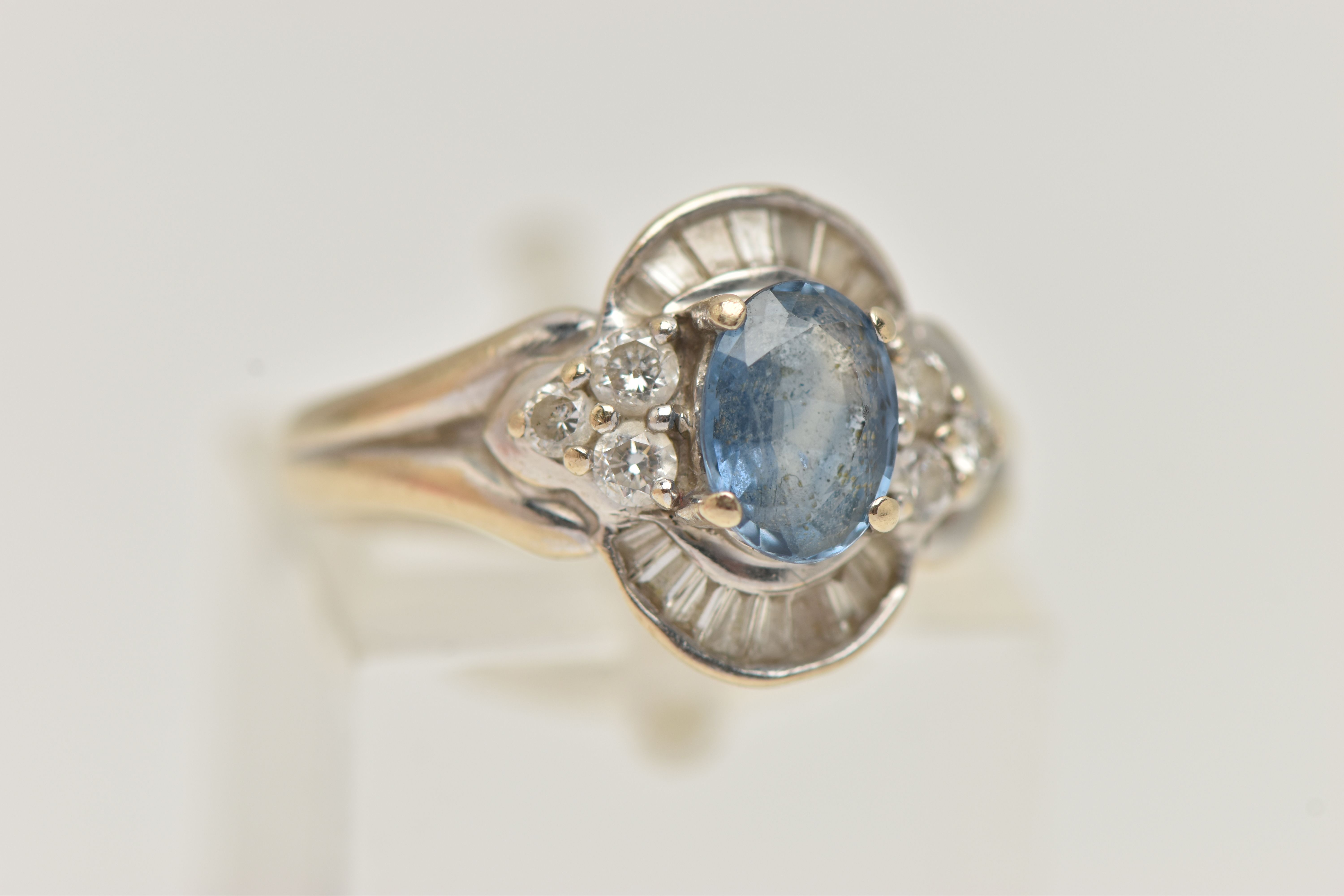 A WHITE METAL SAPPHIRE AND DIAMOND RING, set with an oval cut sapphire, measuring approximately 7. - Image 4 of 4