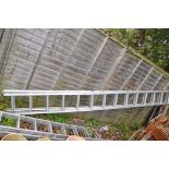A CLIMATE ALUMINIUM DOUBLE EXTENSION LADDER with 14 rungs to each 400cm section