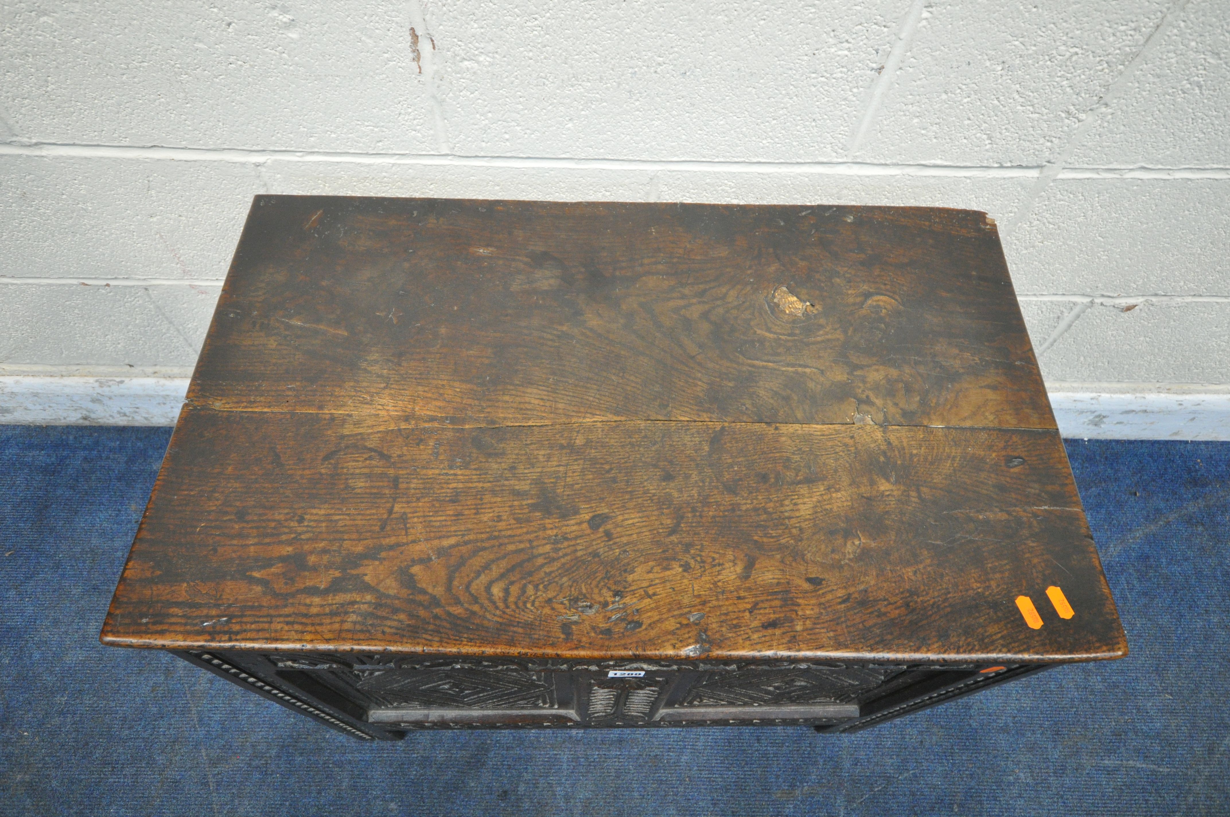 A GEORGIAN OAK COFFER, the hinged lid enclosing a candle box, the front with repeating geometric - Image 2 of 9