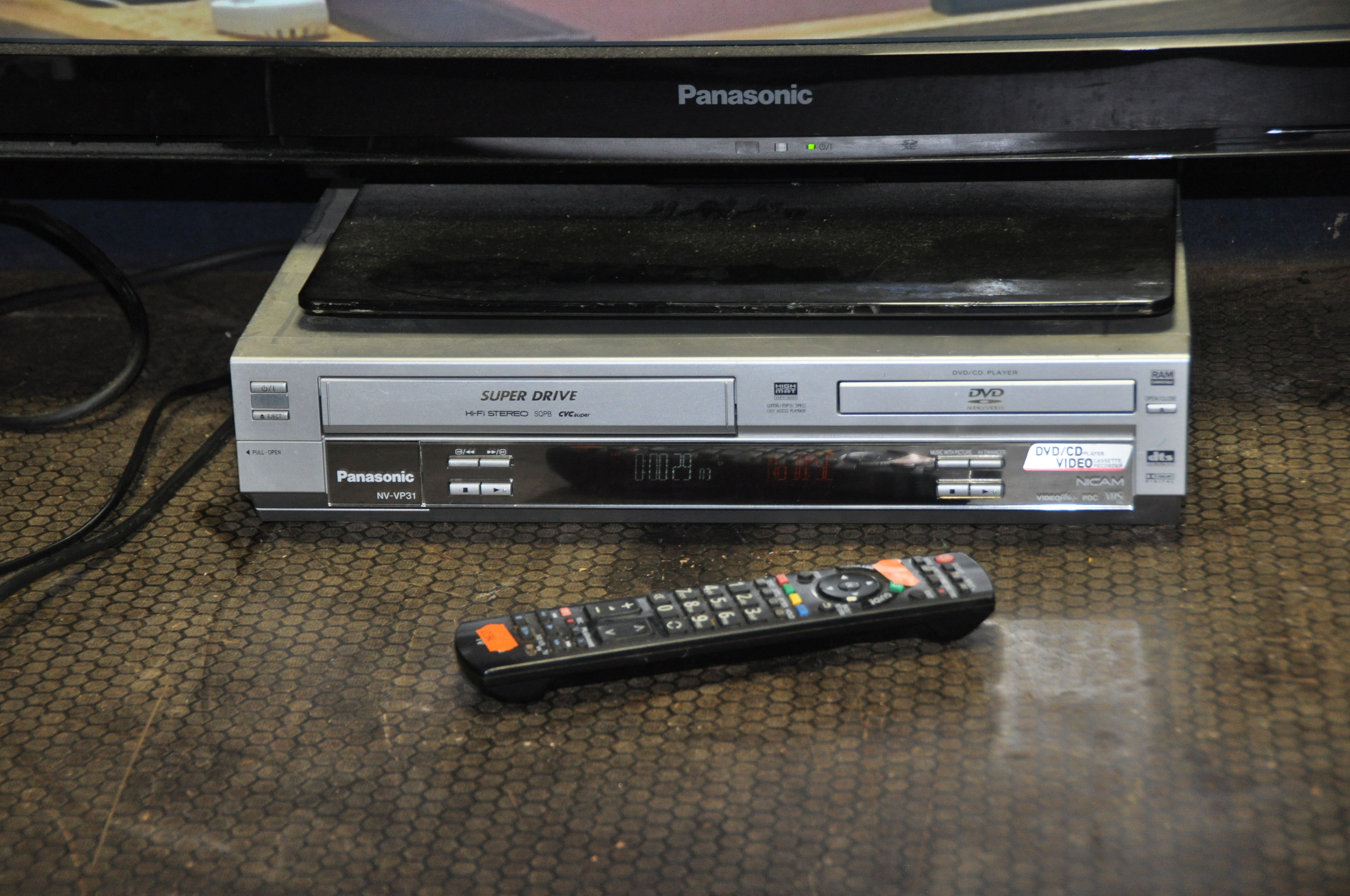 A PANASONIC TX-P42S30B 42in TV WITH REMOTE and a NV-VP31 DVD/Video recorder (both PAT pass and - Image 2 of 2