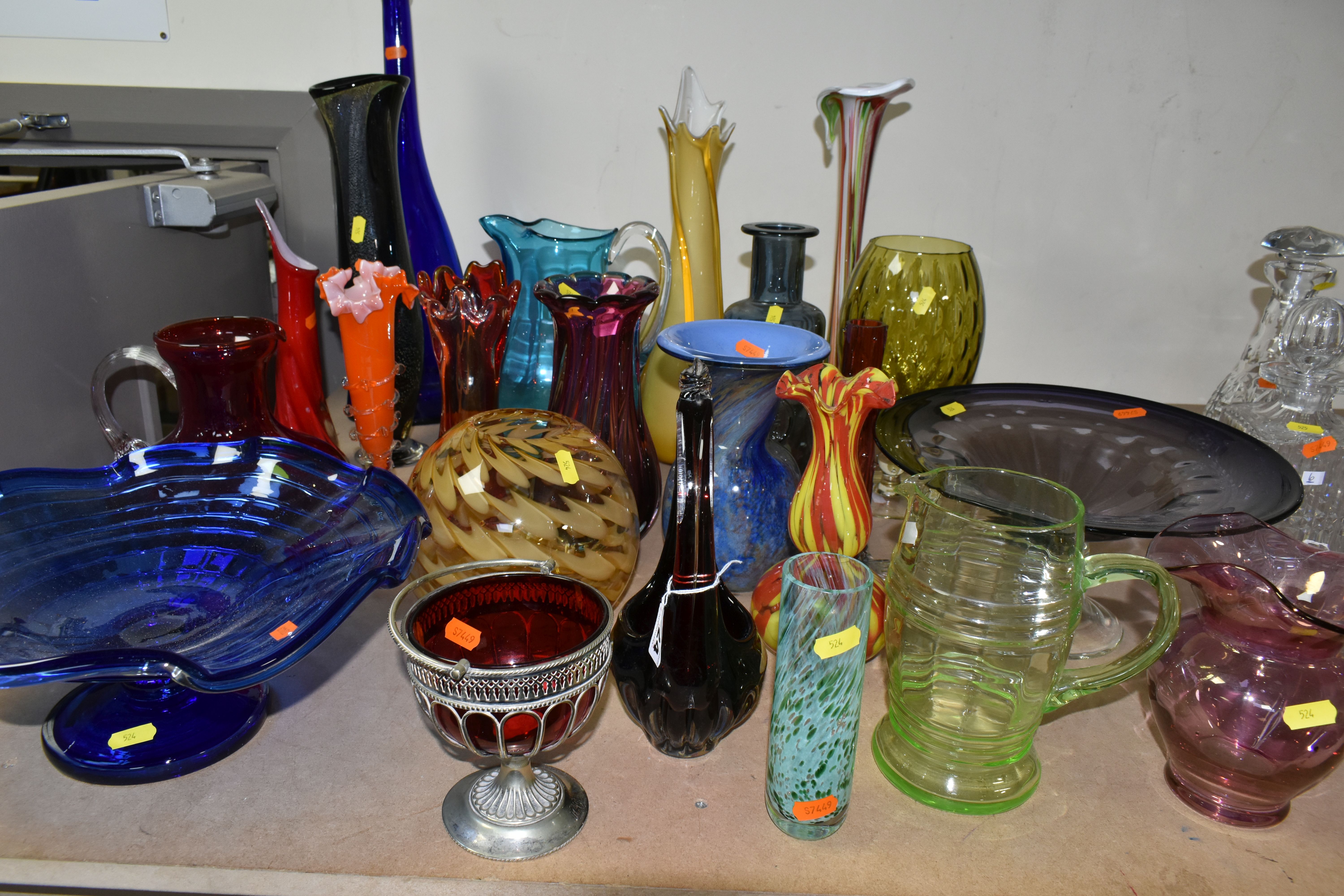 A SELECTION OF DECORATIVE COLOURED GLASSWARES ETC, to include blue and purple pedestal bowls, a tall