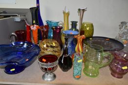 A SELECTION OF DECORATIVE COLOURED GLASSWARES ETC, to include blue and purple pedestal bowls, a tall