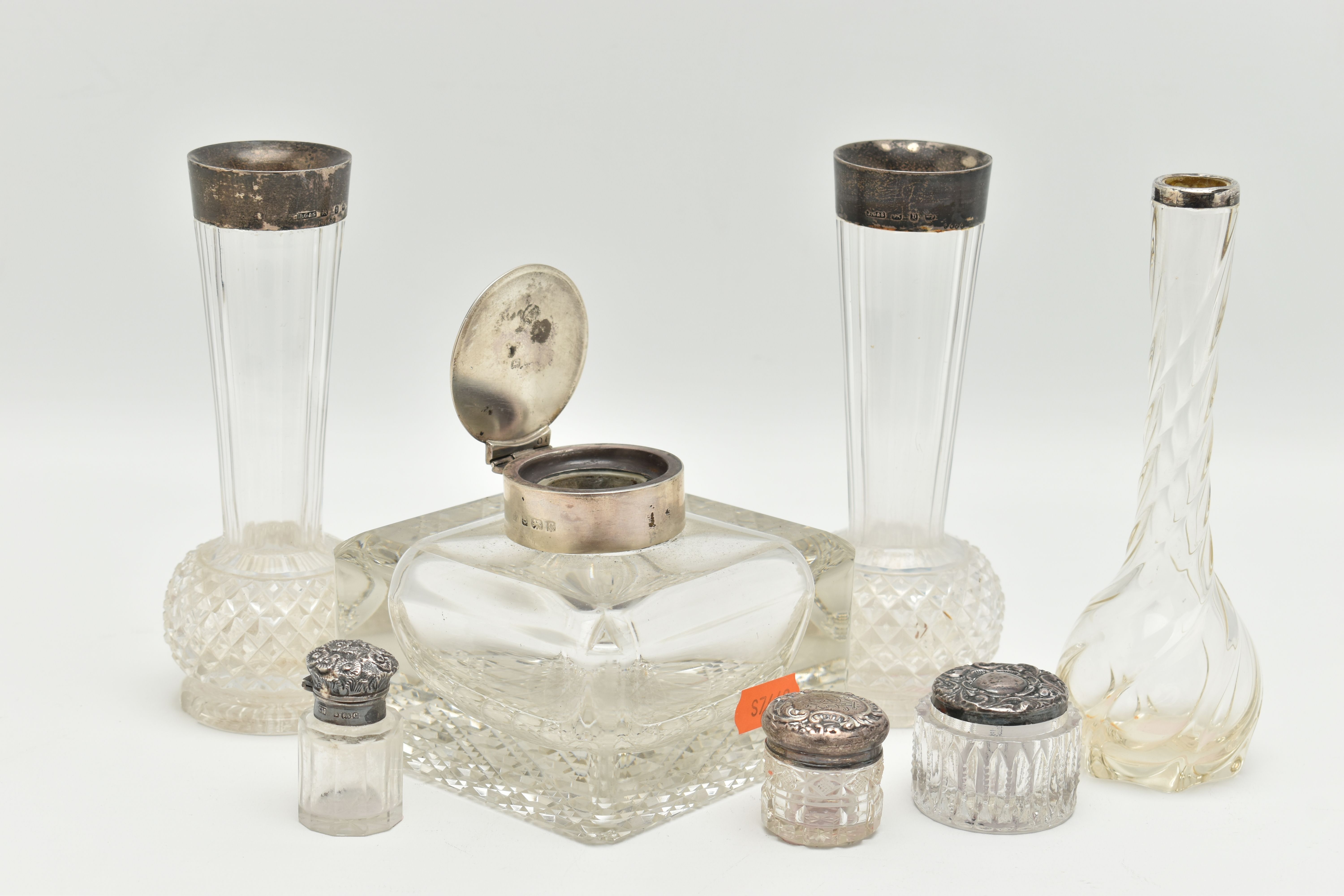 A SMALL ASSORTMENT OF SILVER TOPPED GLASS JARS, to include a silver lidded inkwell, hallmarked '