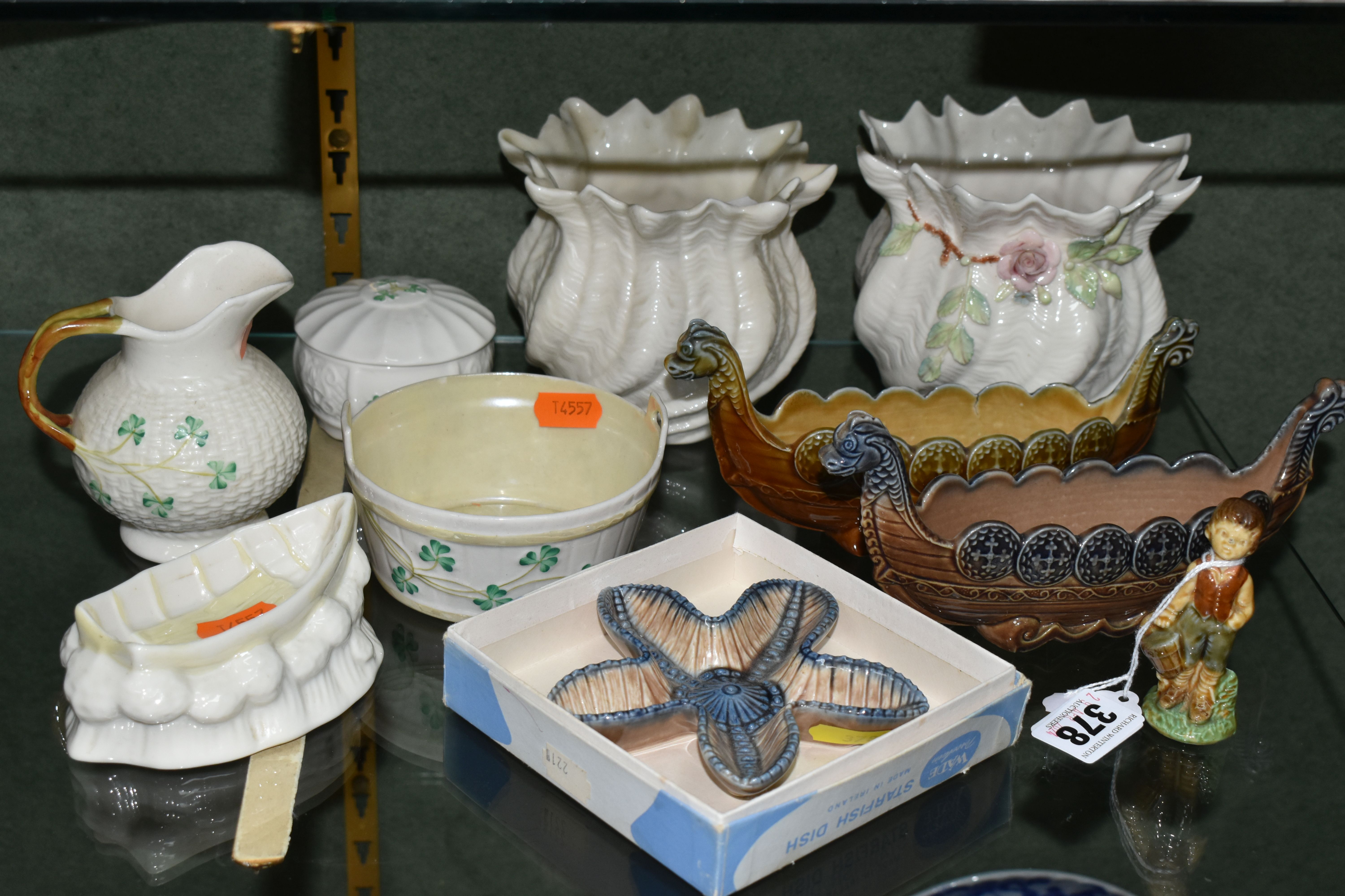 A GROUP OF BELLEEK AND WADE GIFTWARE, comprising two similar Belleek textured planters - one with