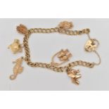 A 9CT GOLD CHARM BRACELET, a double curb link bracelet, fitted with a small heart padlock clasp,