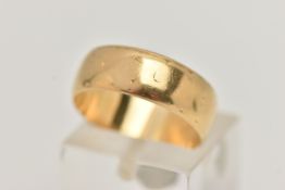 AN 18CT GOLD BAND RING, yellow gold band with a worn etched design, approximate band width 6mm,