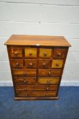 A HARDWOOD CHEST OF FOURTEEN ASSORTED DRAWERS, width 80cm x depth 36cm x height 112cm (condition