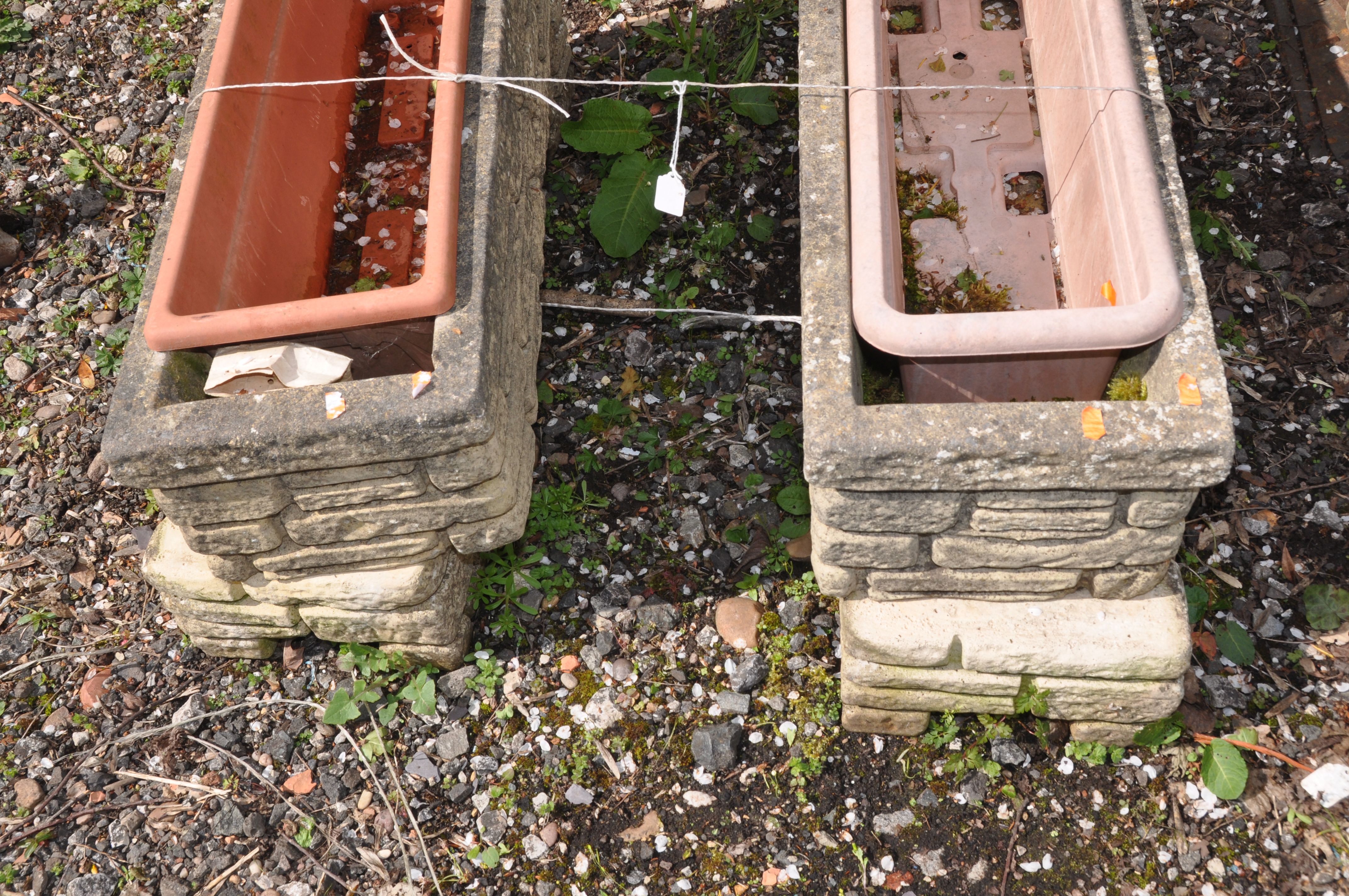 A PAIR OF WEATHERED COMPOSITE RECTANGULAR BRICK EFFECT PLANTERS with matching bases and plastic - Image 2 of 2