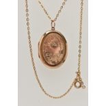 AN EARLY 20TH CENTURY 9CT GOLD FRONT AND BACK LOCKET WITH YELLOW METAL CHAIN, the oval locket with