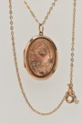 AN EARLY 20TH CENTURY 9CT GOLD FRONT AND BACK LOCKET WITH YELLOW METAL CHAIN, the oval locket with