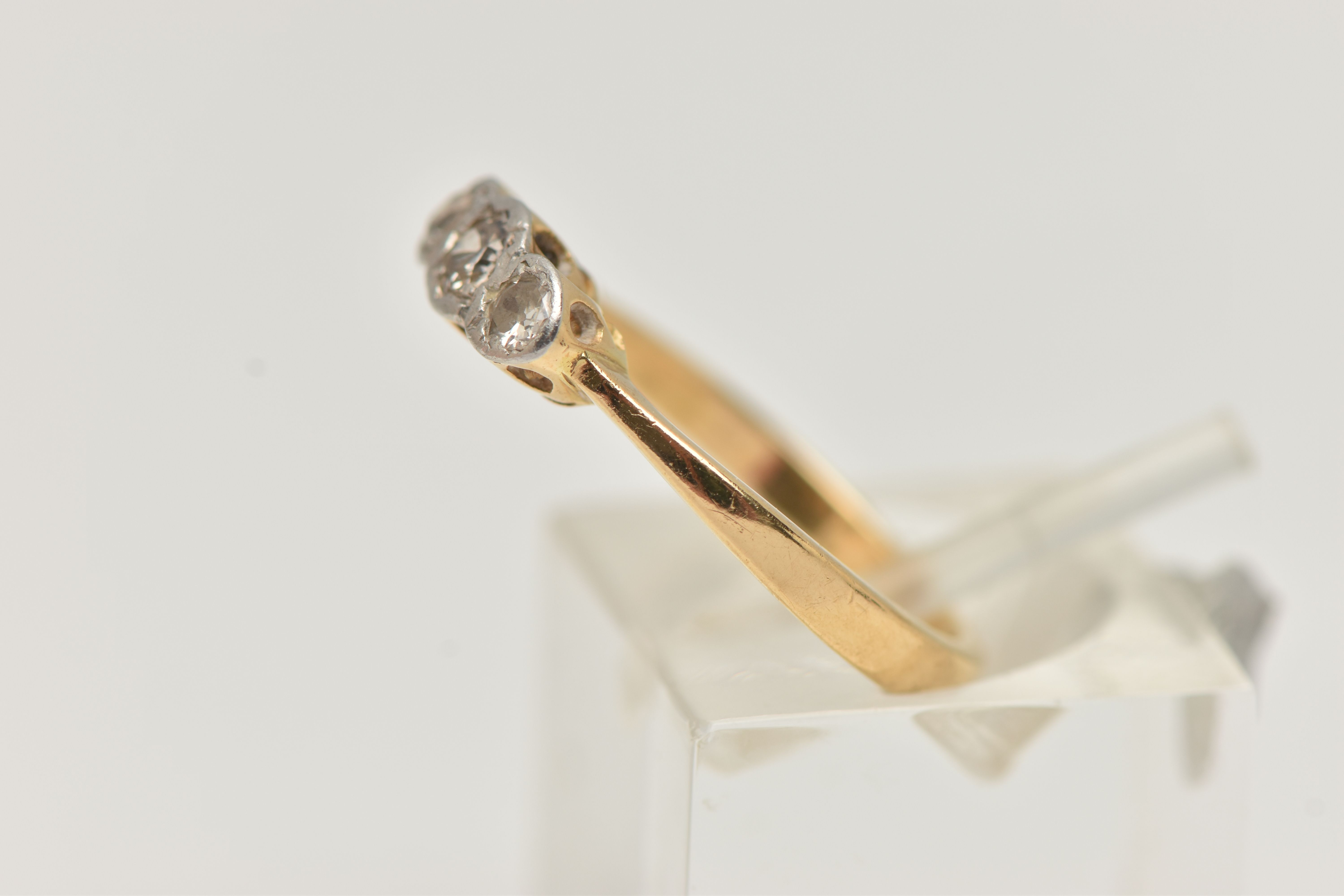 A DIAMOND THREE STONE RING, set with graduating transition cut diamonds, measuring from - Image 2 of 4