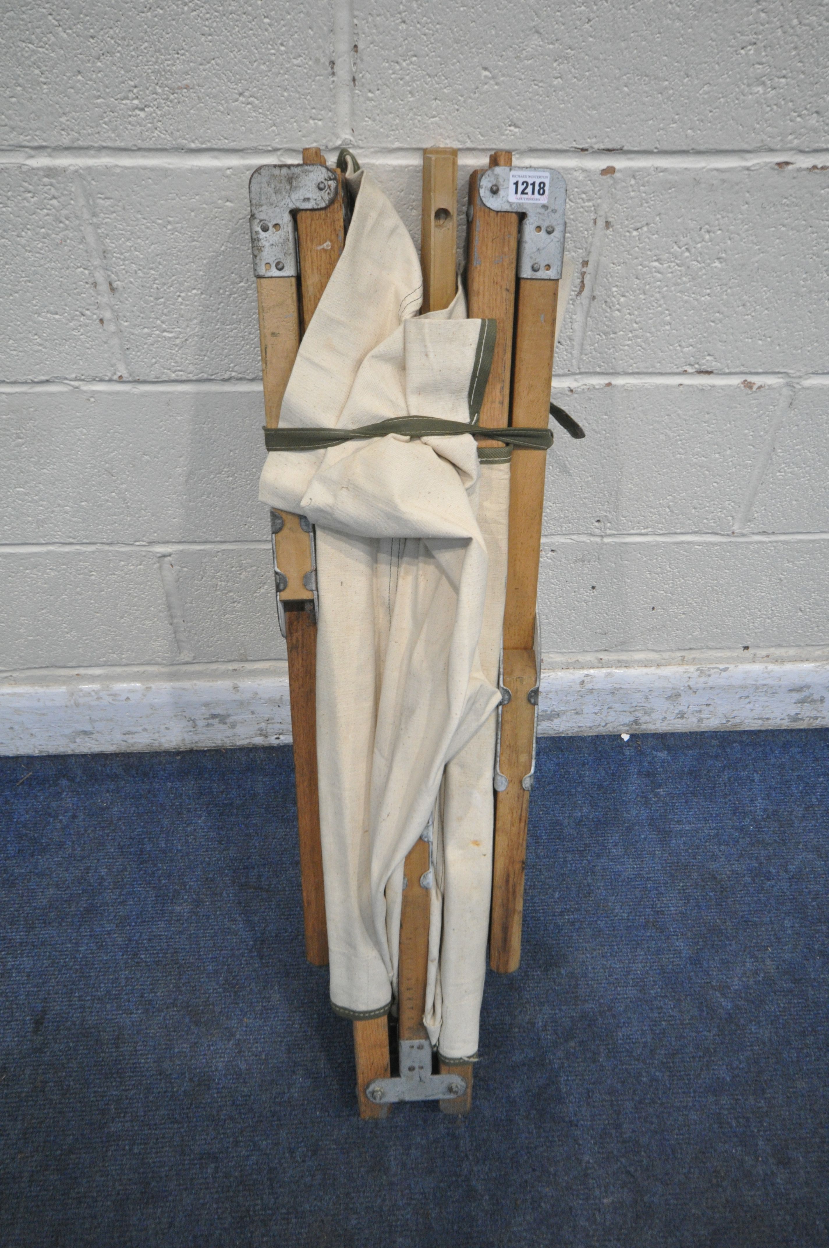 A 20TH CENTURY FOLDING CAMPAIGN STYLE BED, length 195cm (condition report: slightly tear to - Image 5 of 5