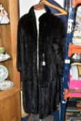 A LADIES' ANKLE LENGTH DARK BROWN FUR COAT, made by Faulkes of Edgbaston, approximate size 12 (1) (