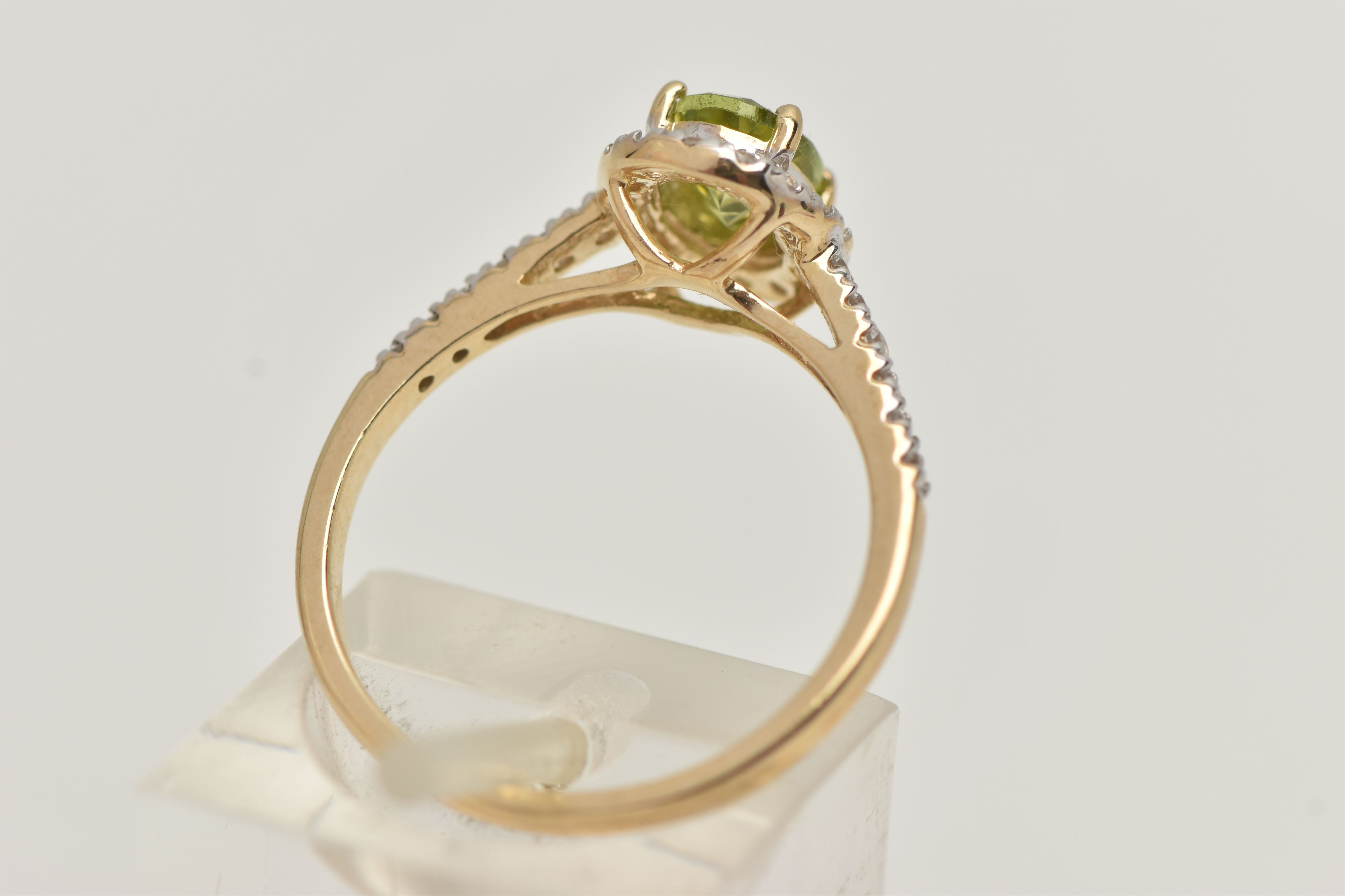 A 9CT GOLD PERIDOT DRESS RING, a principally set oval cut peridot, prong set in yellow gold, set - Image 3 of 4