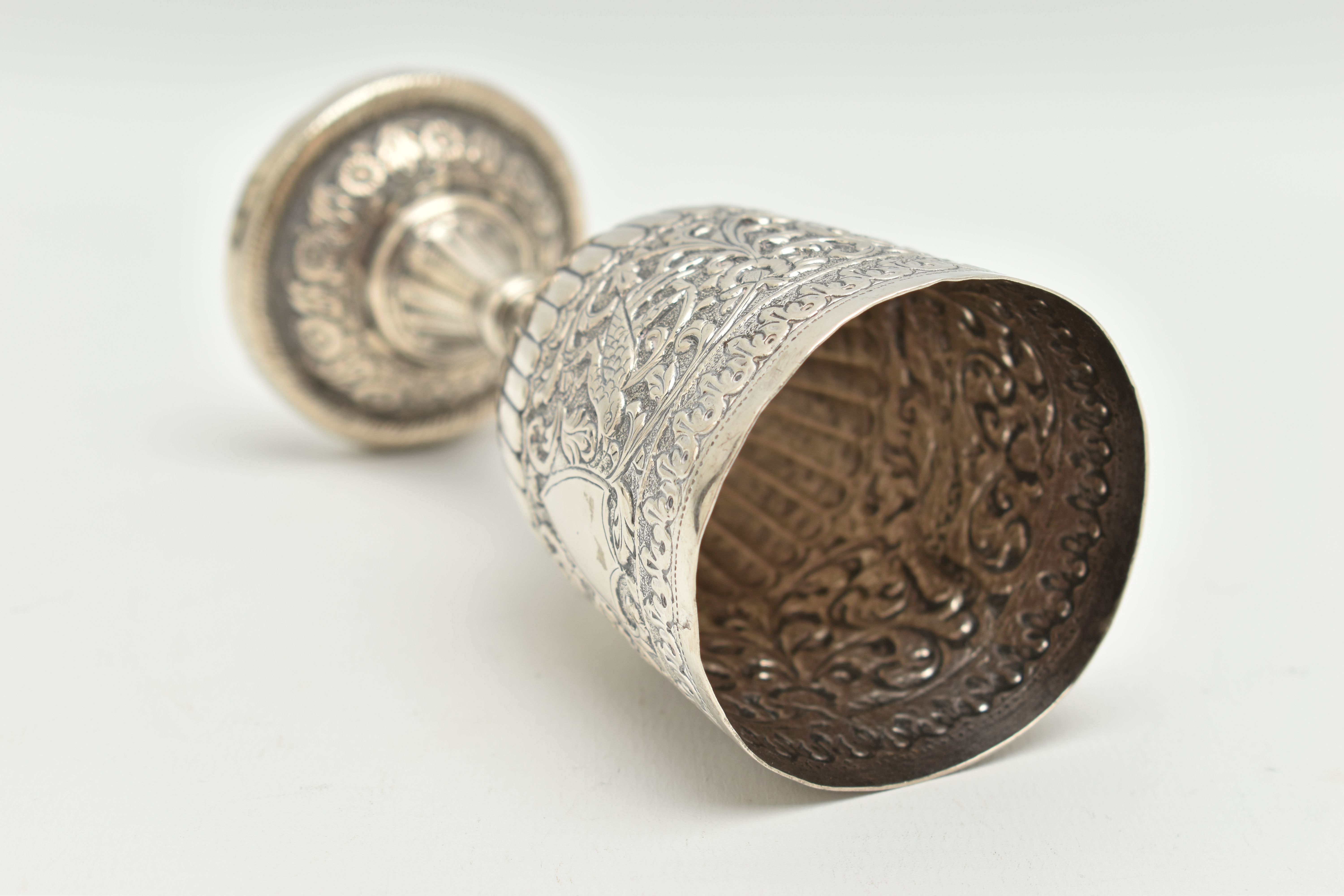 A LATE 19TH CENTURY INDIAN WHITE METAL GOBLET, repoussé decorated with foliate scrolls and birds, - Image 5 of 6