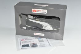 A SIR KENNY DALGLISH SIGNED FOOTBALL BOOT, with certificate of authenticity from AAA Sports
