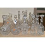 SEVENTEEN DECANTERS AND CARAFES, to include four Victorian globe and shaft examples, Georgian