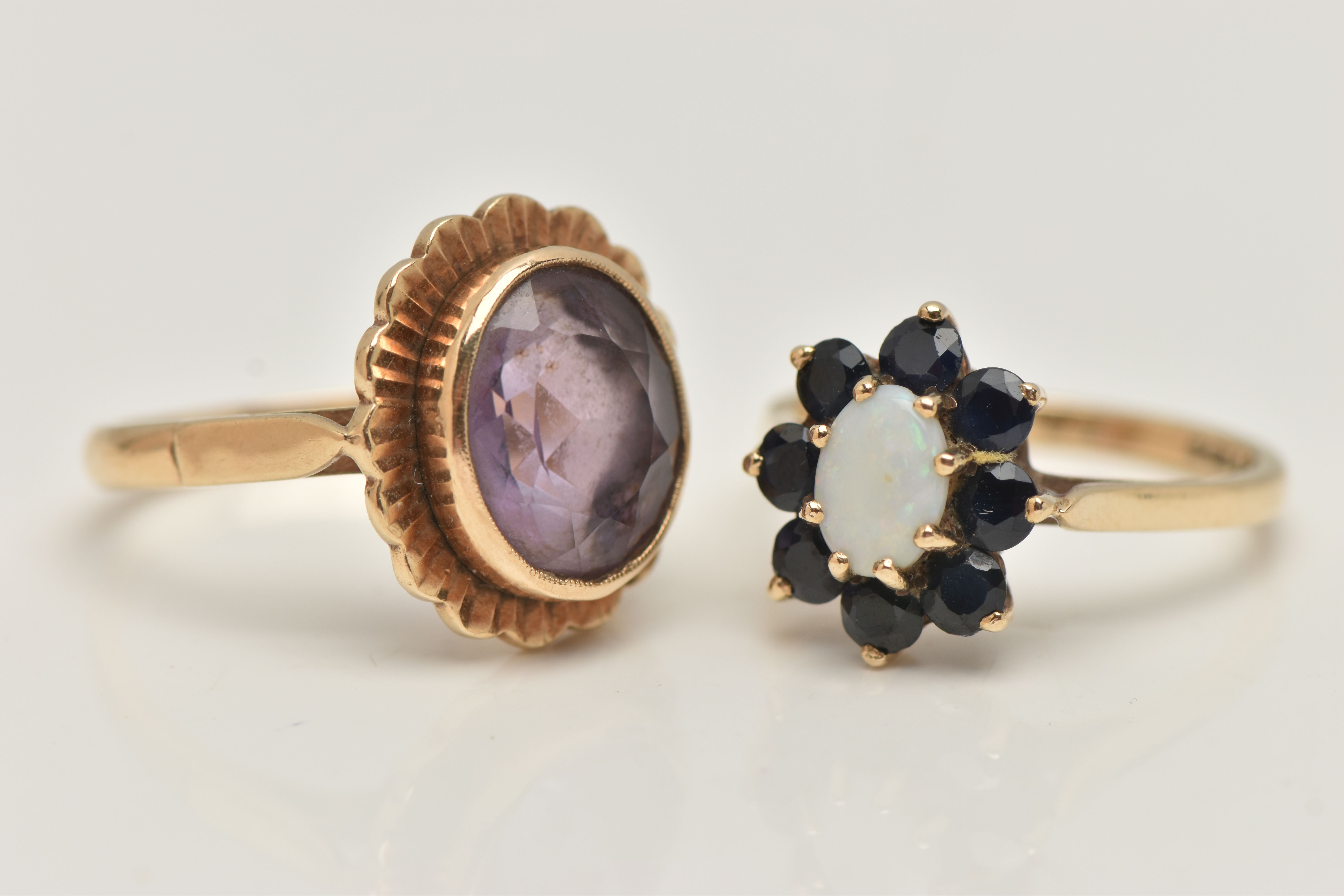 TWO GEM SET RINGS, the first an oval opal set with a surround of circular cut sapphires, prong set - Image 3 of 4