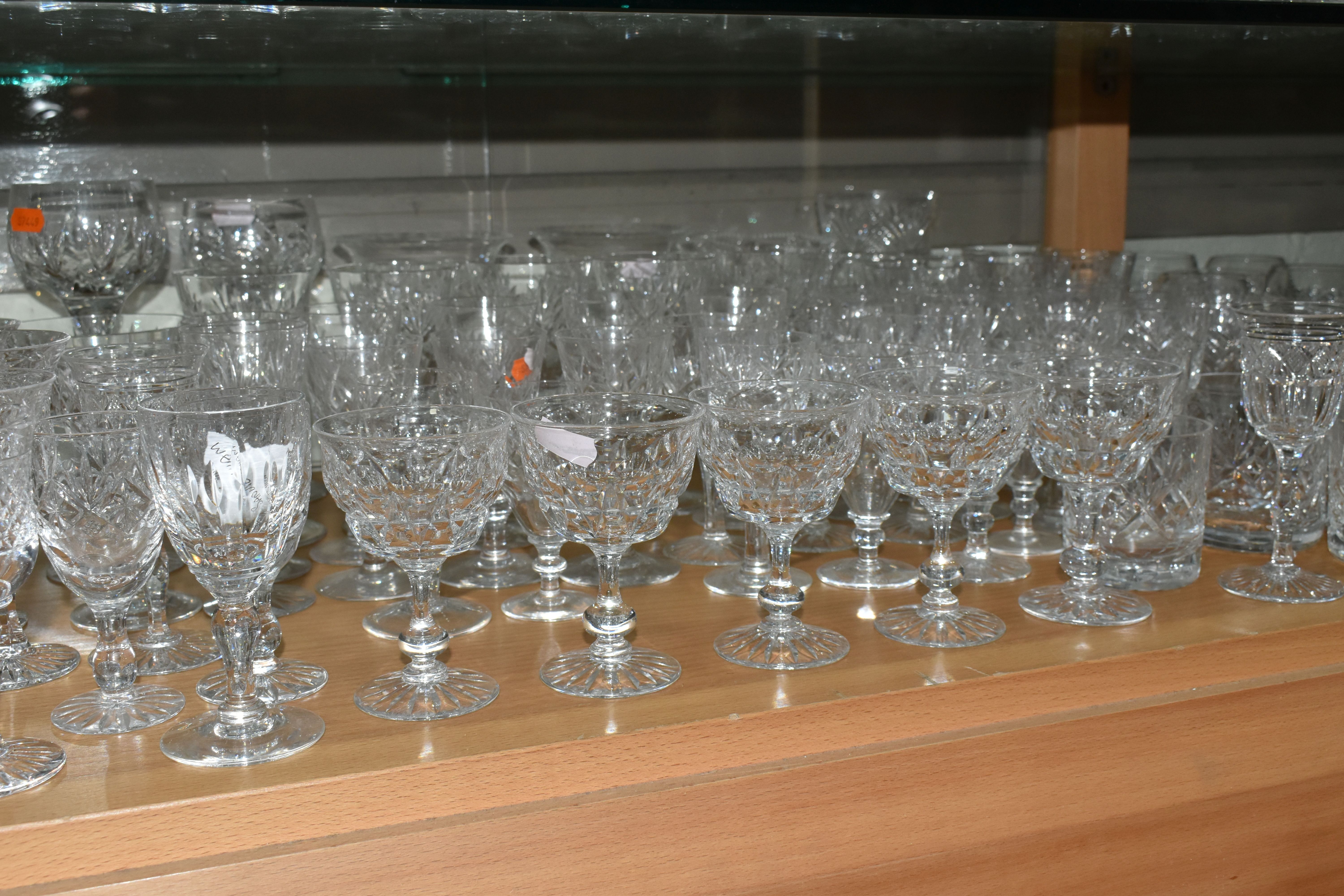A LARGE QUANTITY OF CUT CRYSTAL WINE GLASSES AND WHISKY TUMBLERS, maker's names include Tudor