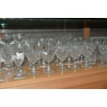 A LARGE QUANTITY OF CUT CRYSTAL WINE GLASSES AND WHISKY TUMBLERS, maker's names include Tudor