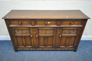 A GOOD QUALITY REPRODUCTION TITCHMARSH AND GOODWIN STYLE OAK SIDEBOARD, fitted with three drawers,