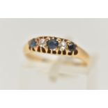 AN EARLY 20TH CENTURY DIAMOND AND SAPPHIRE RING, 18ct yellow gold boat ring, set with three circular