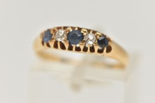 AN EARLY 20TH CENTURY DIAMOND AND SAPPHIRE RING, 18ct yellow gold boat ring, set with three circular