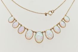 A YELLOW METAL SYNTHETIC OPAL PENDANT NECKLACE, designed as a series of nine graduated synthetic