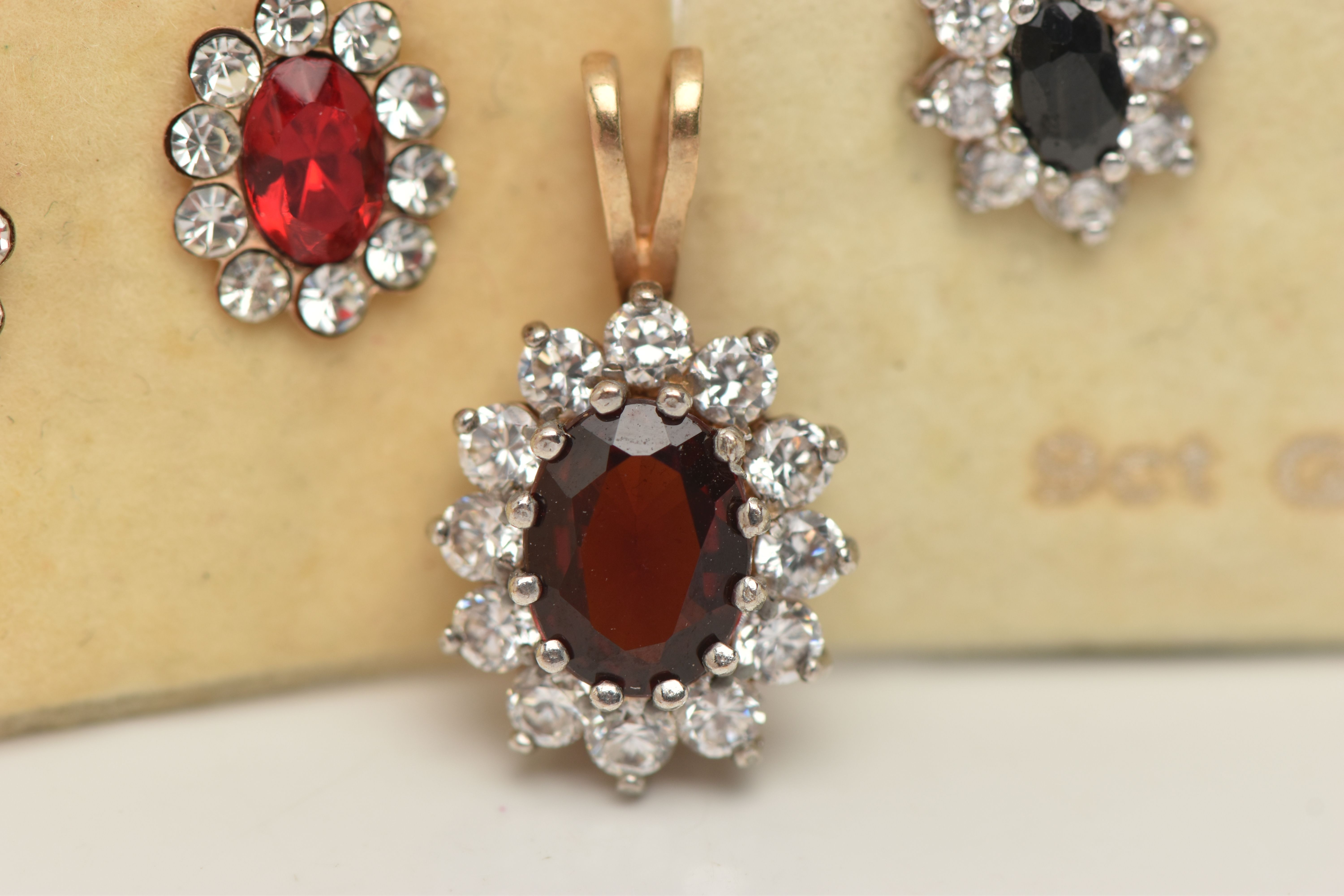 TWO PAIRS OF EARRINGS AND A PENDANT, the 9ct gold cluster pendant with central oval red gem assessed - Image 4 of 4