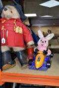 TWO PADDINGTON BEARS AND A DURACELL BUNNY TOY, comprising Paddington wearing a red coat, blue hat