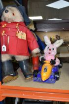 TWO PADDINGTON BEARS AND A DURACELL BUNNY TOY, comprising Paddington wearing a red coat, blue hat