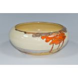 A CLARICE CLIFF CORAL FIRS PATTERN BOWL, painted with a stylised coastal landscape on a cream