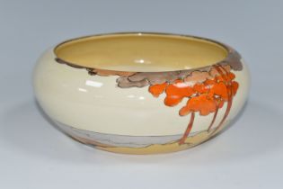 A CLARICE CLIFF CORAL FIRS PATTERN BOWL, painted with a stylised coastal landscape on a cream