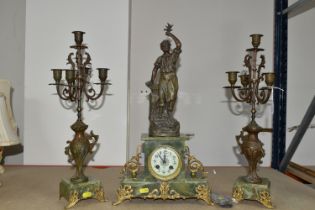 A FRENCH GREEN ONYX CLOCK GARNITURE, with key and pendulum, gilt metal foliate feet, enamel dial