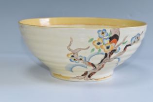 A CLARICE CLIFF 'TIGER TREES' PATTERN BOWL, the ribbed bowl painted with the stylised trees on a