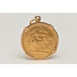 AN EARLY 20TH CENTURY HALF SOVEREIGN PENDANT, half sovereign dated 1917, within a yellow metal
