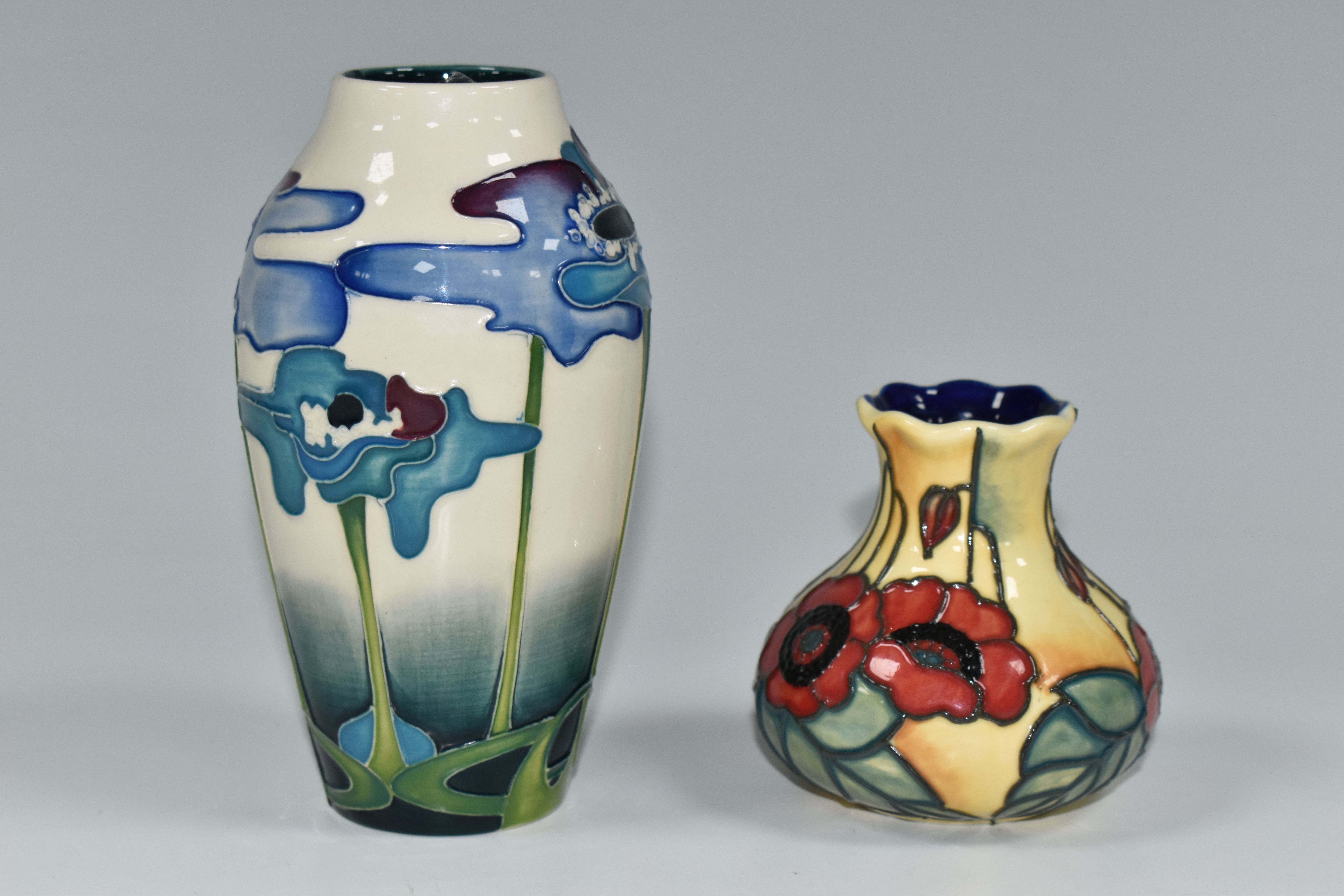 A MOORCROFT POTTERY VASE AND A SIMILAR OLD TUPTON WARE VASE, the Moorcroft Pottery baluster vase