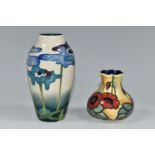 A MOORCROFT POTTERY VASE AND A SIMILAR OLD TUPTON WARE VASE, the Moorcroft Pottery baluster vase